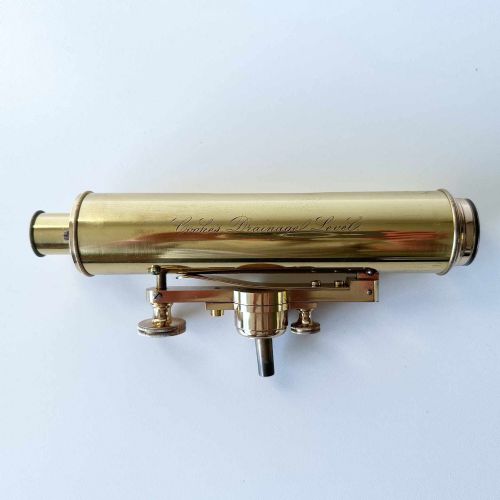 fig 1. An antique brass optical surveying drainage level positioned inside a open fitted mahogany wooden box.