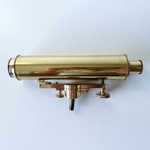 fig 3. An antique brass optical surveying drainage level positioned inside a open fitted mahogany wooden box.