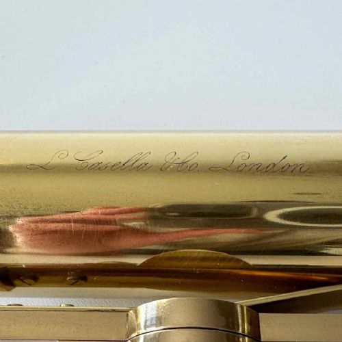 fig 4. An antique brass optical surveying drainage level positioned inside a open fitted mahogany wooden box.