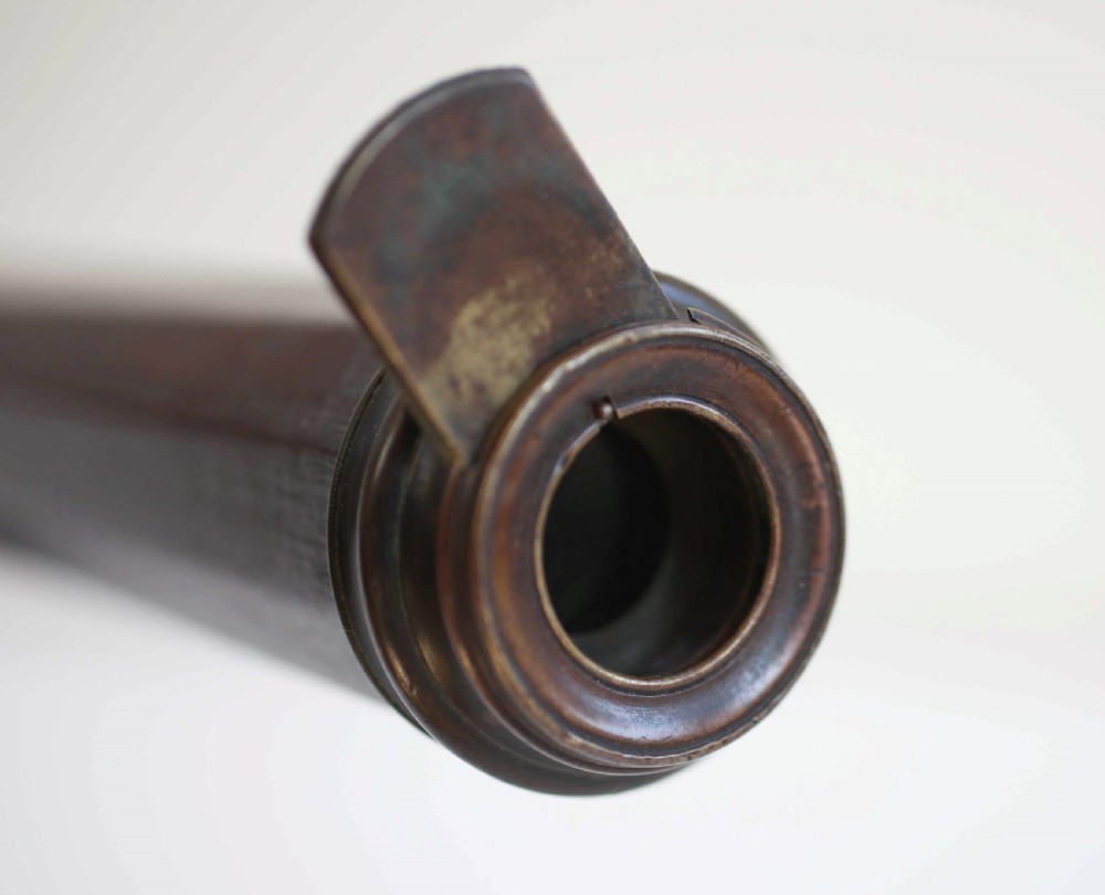 A mid-eighteenth-century dark mahogany decagonal optical telescope mounted horizontally on a matching dark wooden display stand. View IV