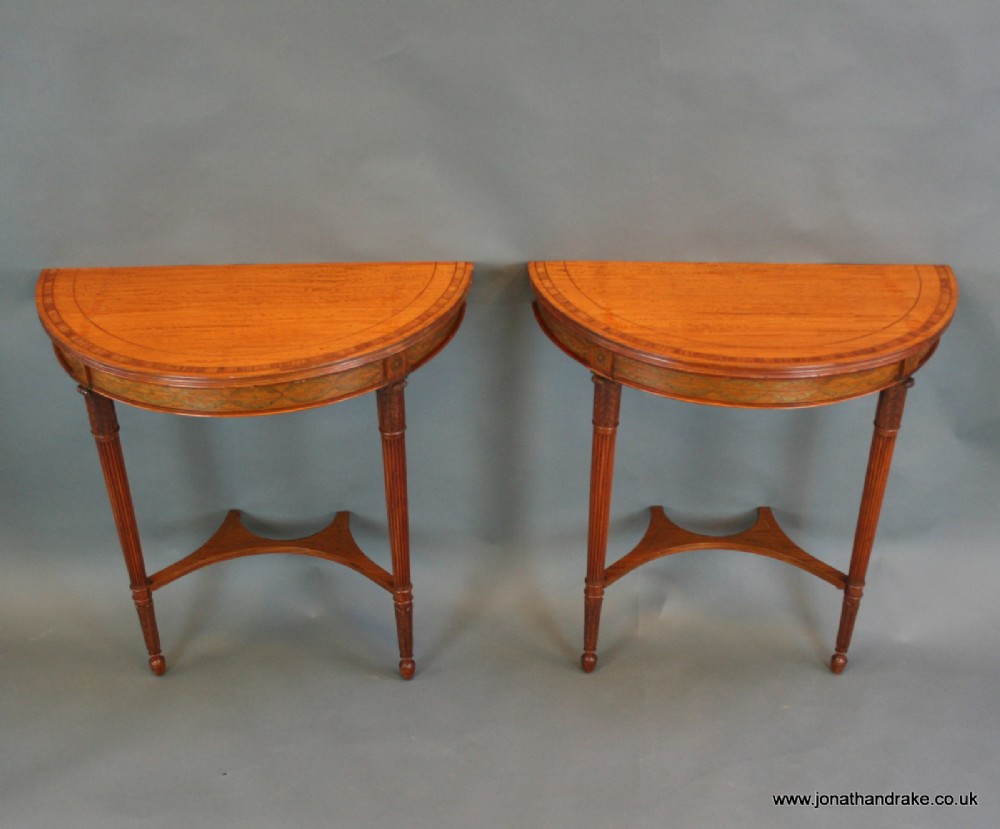 A pair of Edwardian satinwood console pier tables