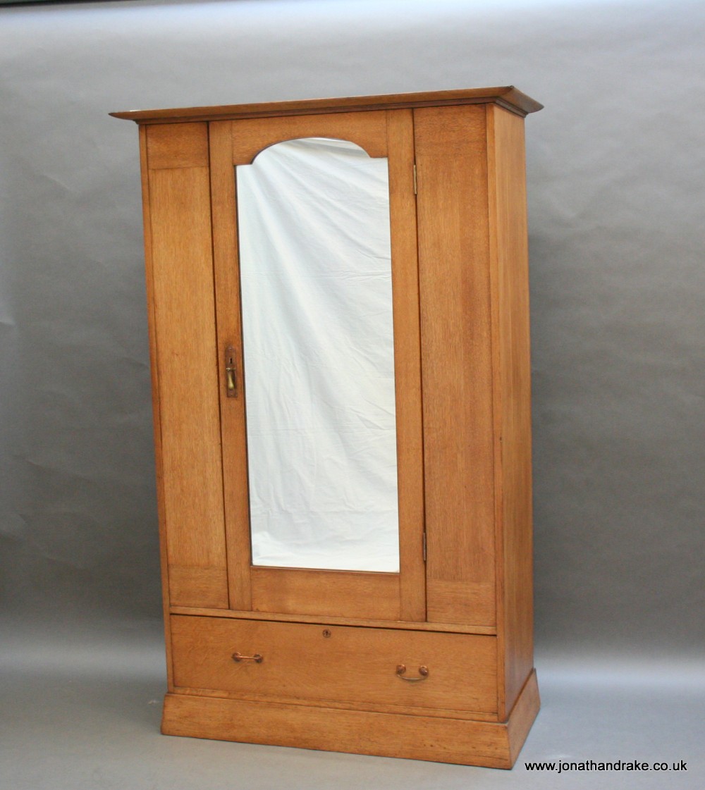 Arts & Crafts wardrobe manner of Voysey