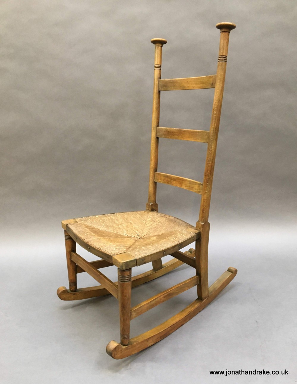 arts and crafts rocking chair by Libertys