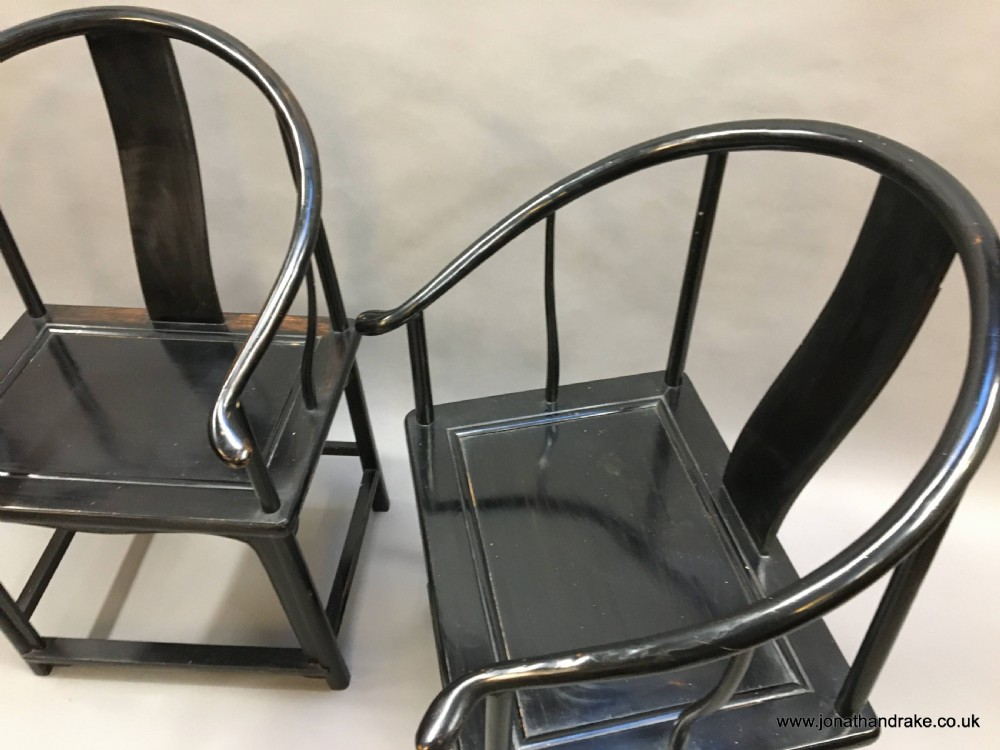 Pair Chinese ebonised horseshoe chairs View II