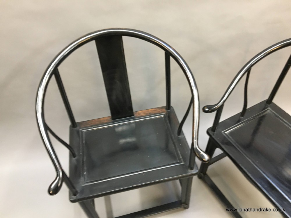 Pair Chinese ebonised horseshoe chairs View III
