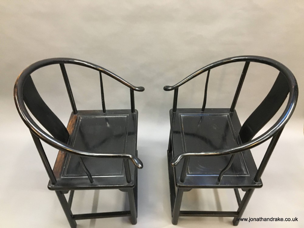Pair Chinese ebonised horseshoe chairs View IV