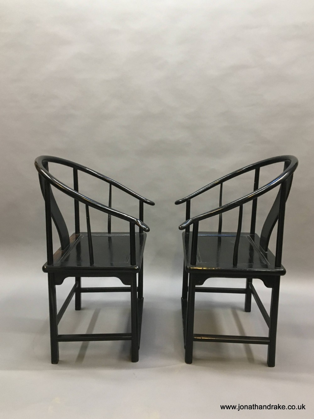 Pair Chinese ebonised horseshoe chairs View V