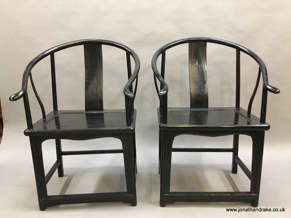 Pair Chinese ebonised horseshoe chairs View VI