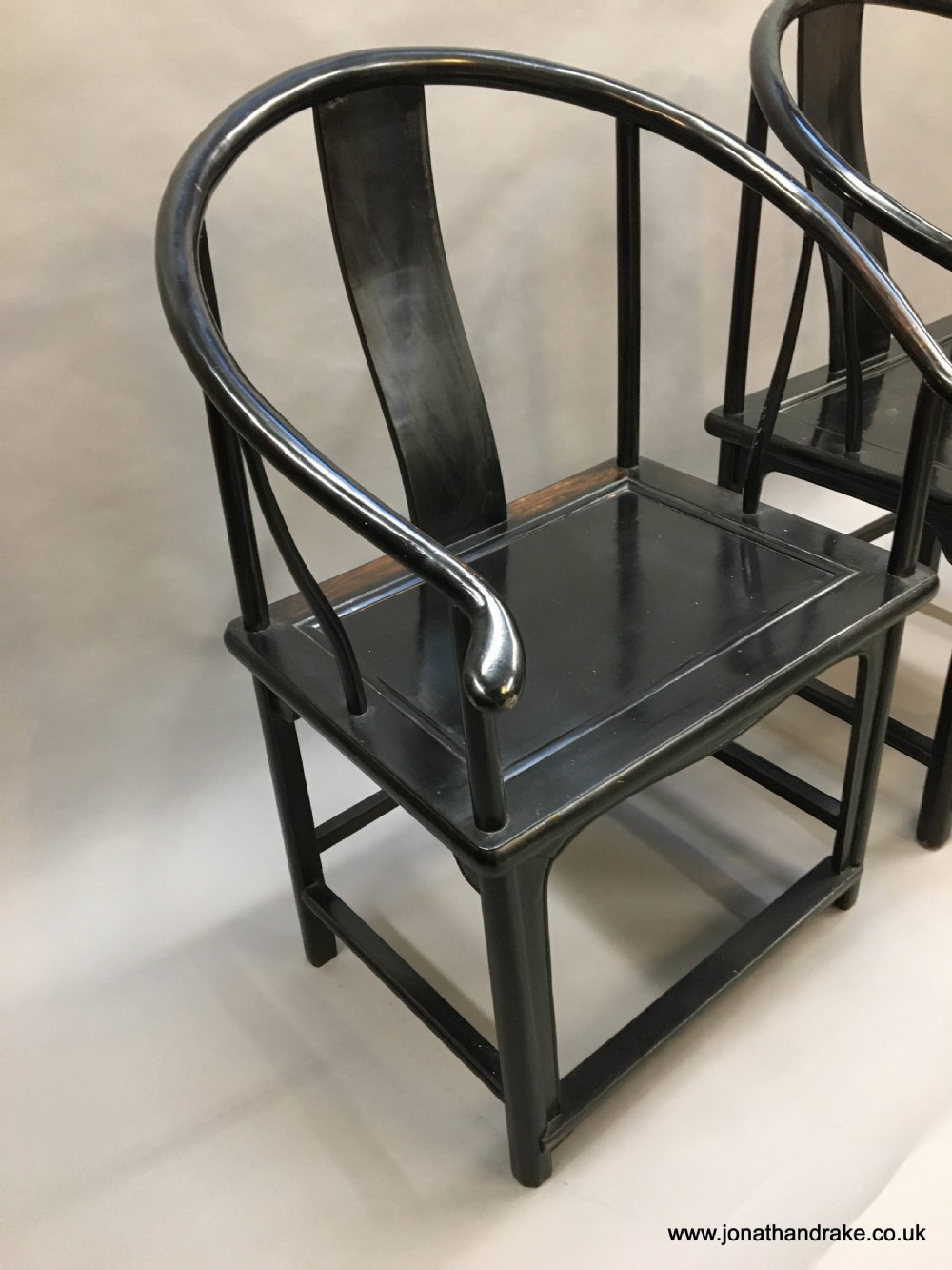 Pair Chinese ebonised horseshoe chairs View VII