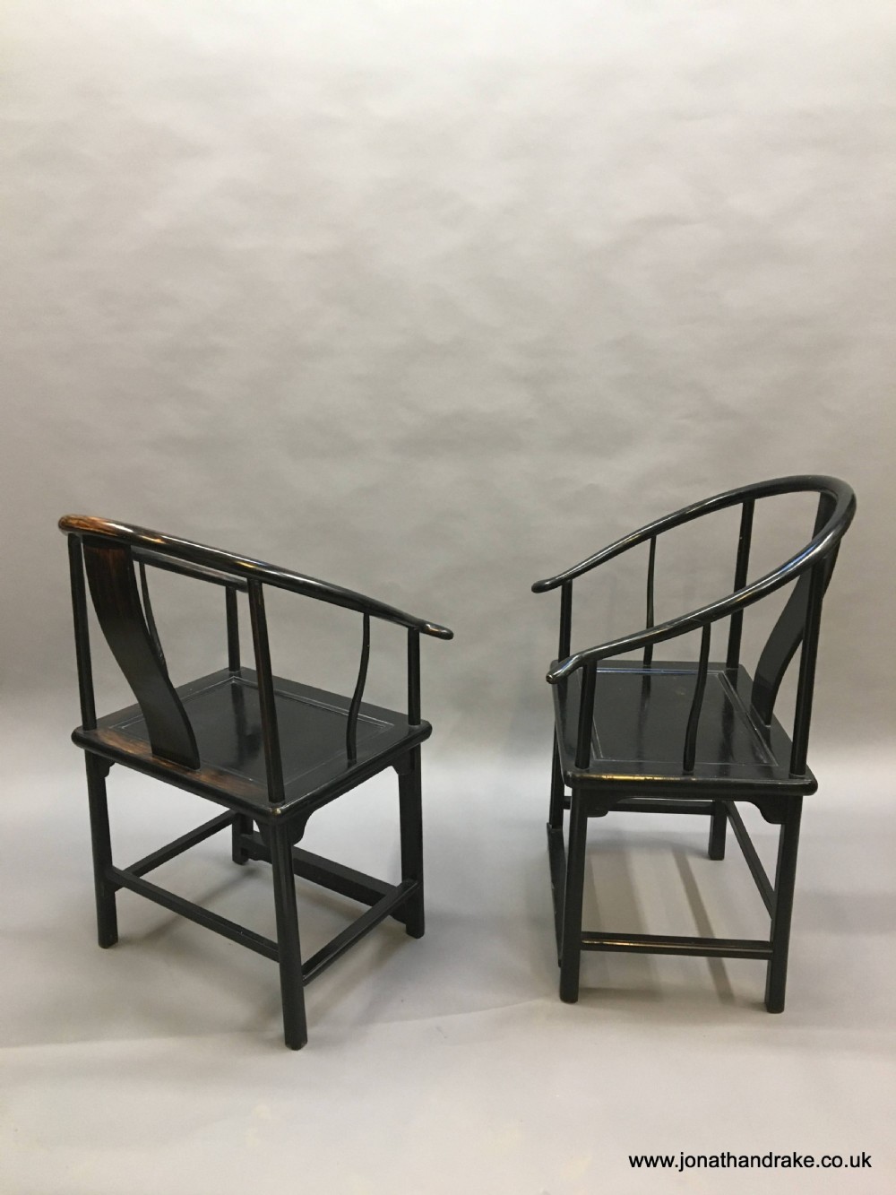 Pair Chinese ebonised horseshoe chairs View VIII