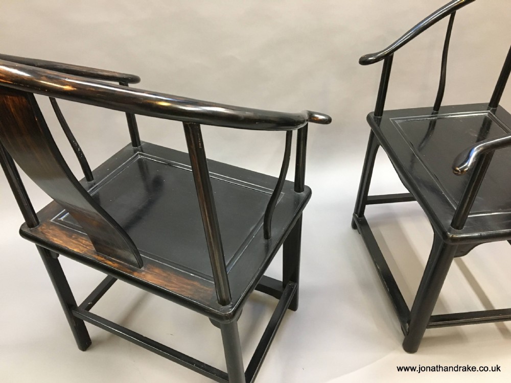 Pair Chinese ebonised horseshoe chairs View IX