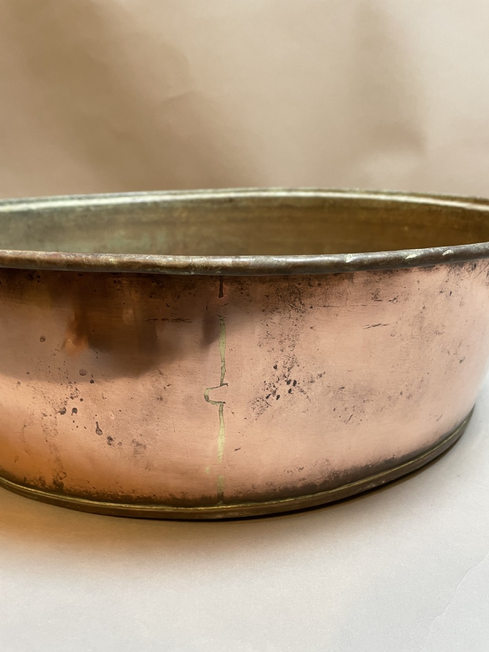 A large nineteenth-century circular copper preserve pan featuring flared sides, a rolled rim, and an aged interior showing signs of historical wear. View IV