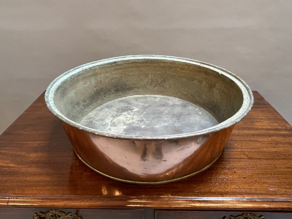 A large nineteenth-century circular copper preserve pan featuring flared sides, a rolled rim, and an aged interior showing signs of historical wear. View VIII