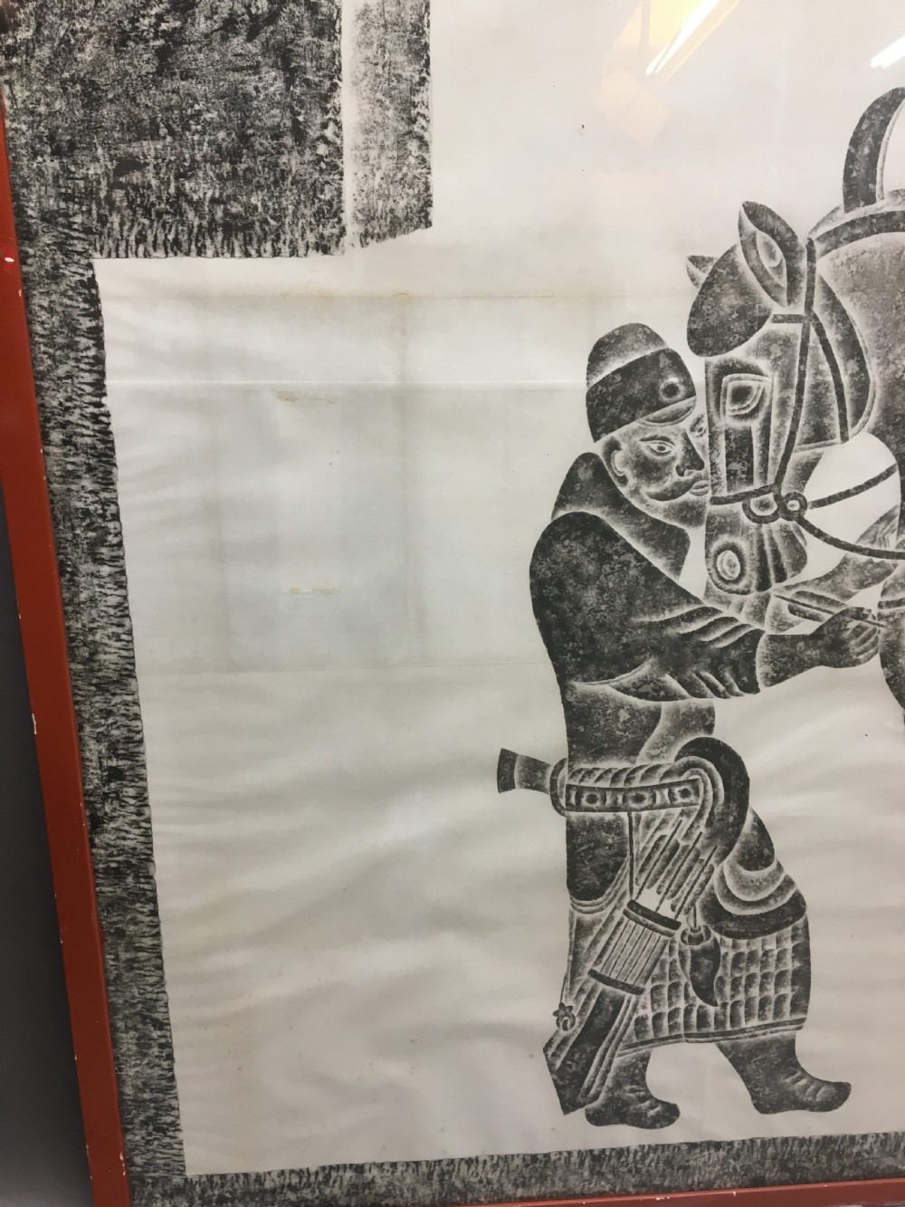 A large monochrome framed paper rubbing depicting a groom attending to a saddled Tang Dynasty horse. View XIII