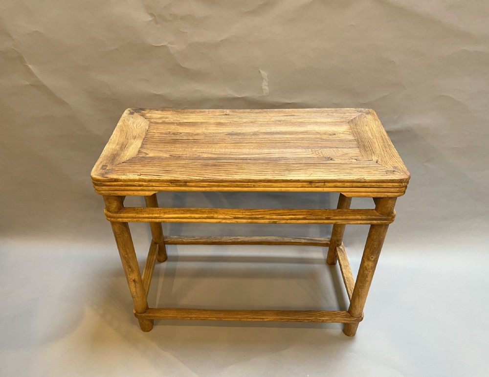A 19th-century Chinese rectangular elm side table with double stretchers, natural wood grain, and straight cylindrical legs. View III