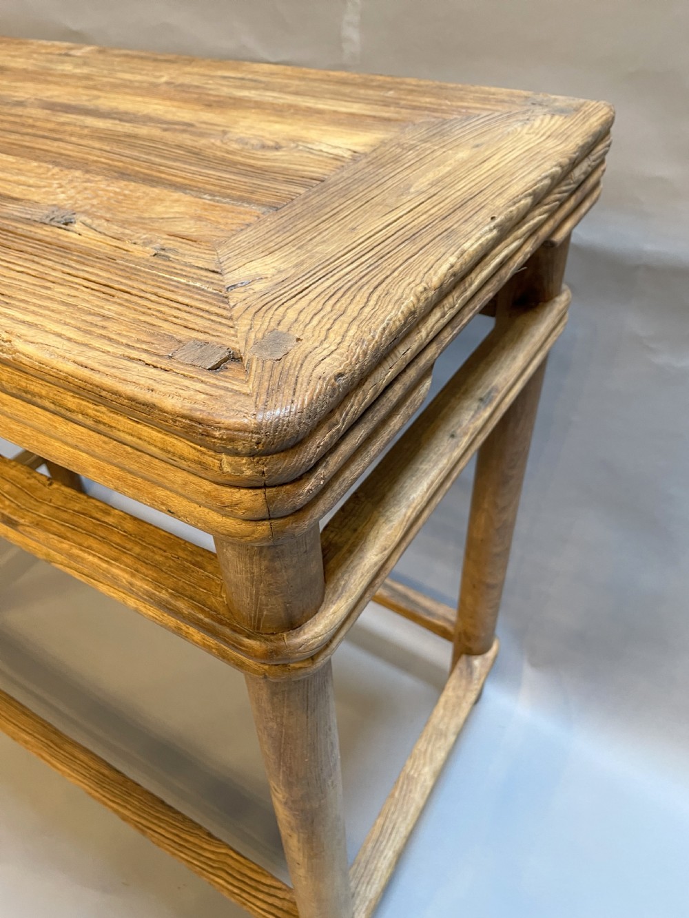 A 19th-century Chinese rectangular elm side table with double stretchers, natural wood grain, and straight cylindrical legs. View IV