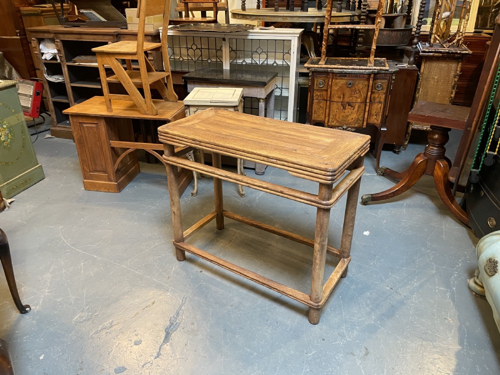 A 19th-century Chinese rectangular elm side table with double stretchers, natural wood grain, and straight cylindrical legs. View V