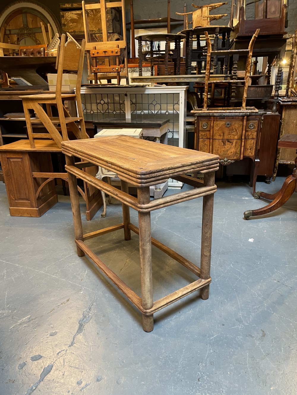A 19th-century Chinese rectangular elm side table with double stretchers, natural wood grain, and straight cylindrical legs. View VI