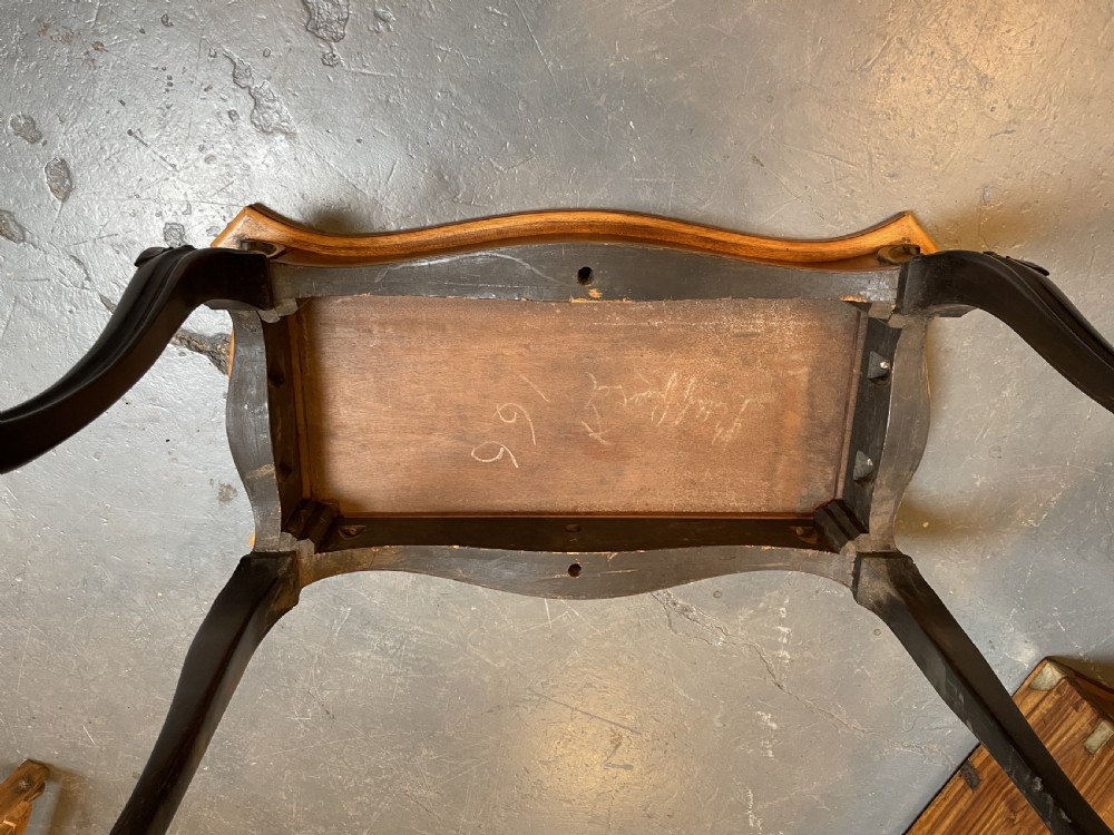 A 19th-century Ceylonese serpentine centre table featuring dark hardwood construction, a light wood crossbanded top, and carved cabriole legs. View XI