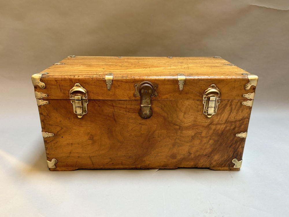 A rectangular solid camphor wood steamer trunk featuring metal corner brackets, metal latches, and side carrying handles. View VIII