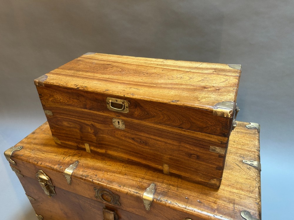 A small nineteenth-century camphor wood campaign trunk with brass corner mounts, flush handles, and keyhole escutcheon. View II