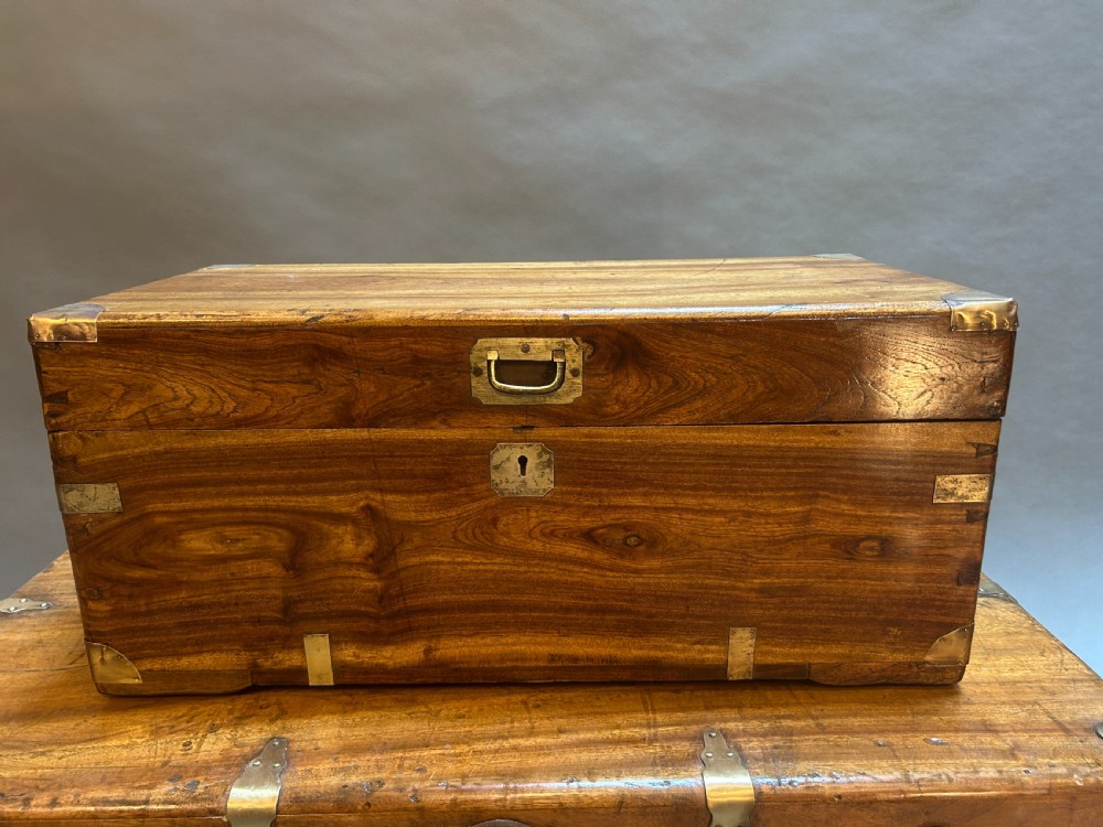 A small nineteenth-century camphor wood campaign trunk with brass corner mounts, flush handles, and keyhole escutcheon. View III