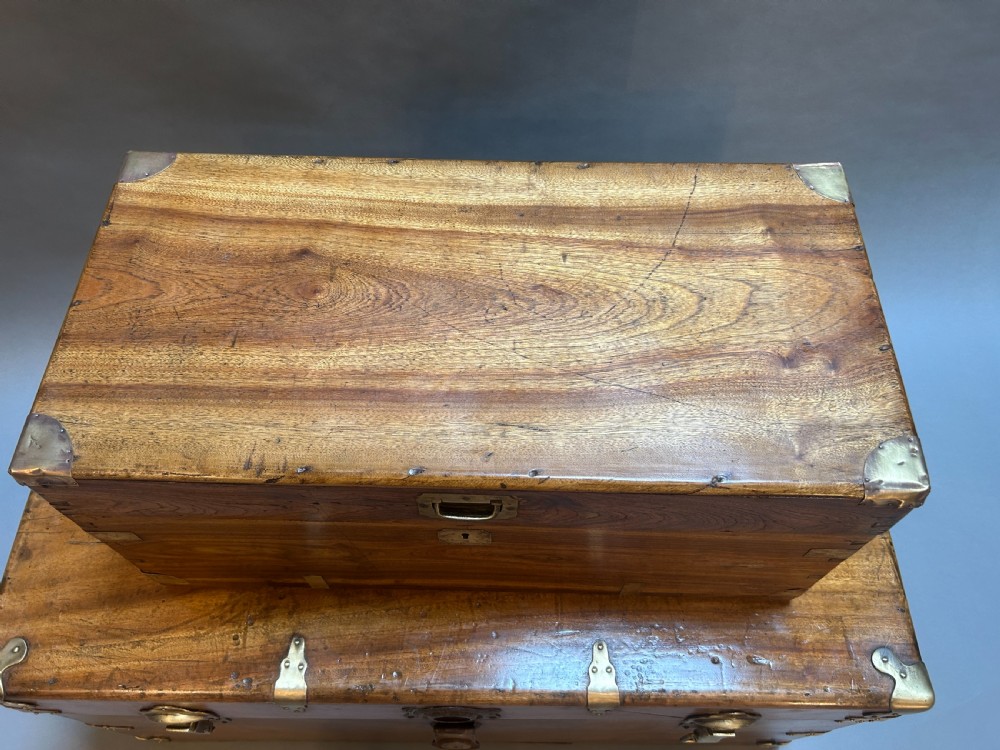 A small nineteenth-century camphor wood campaign trunk with brass corner mounts, flush handles, and keyhole escutcheon. View IV