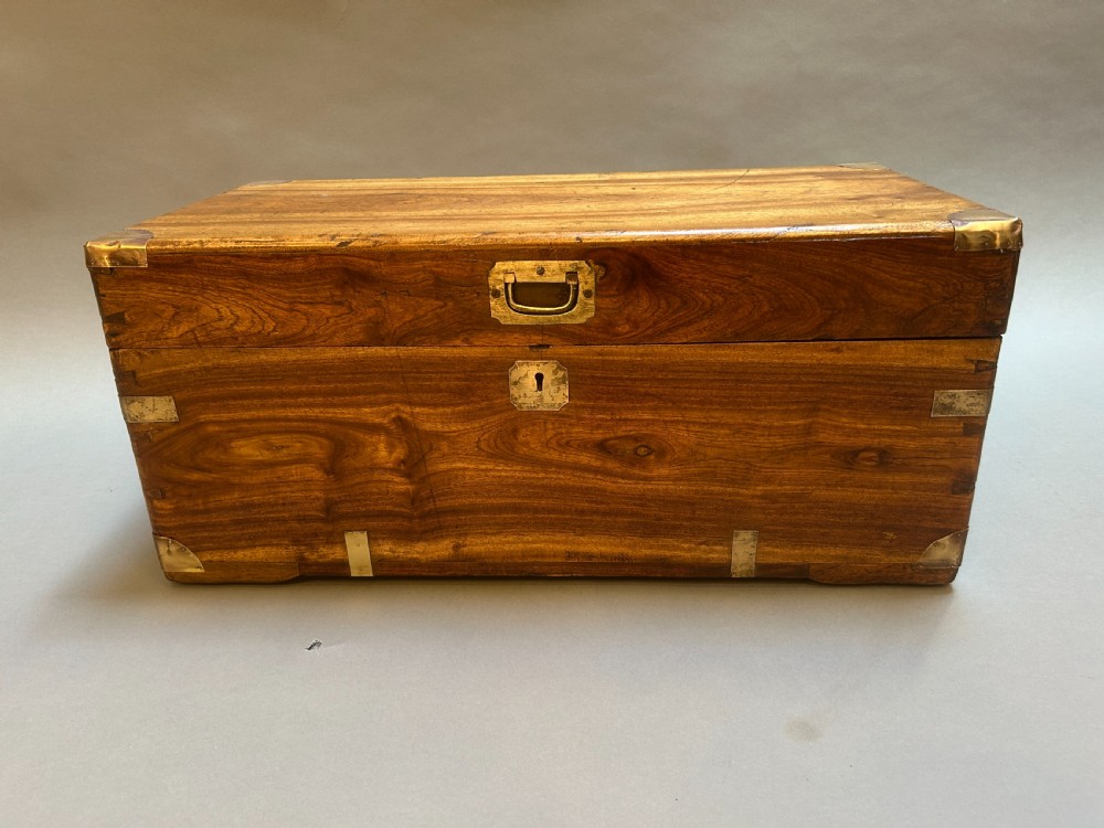 A small nineteenth-century camphor wood campaign trunk with brass corner mounts, flush handles, and keyhole escutcheon. View VII