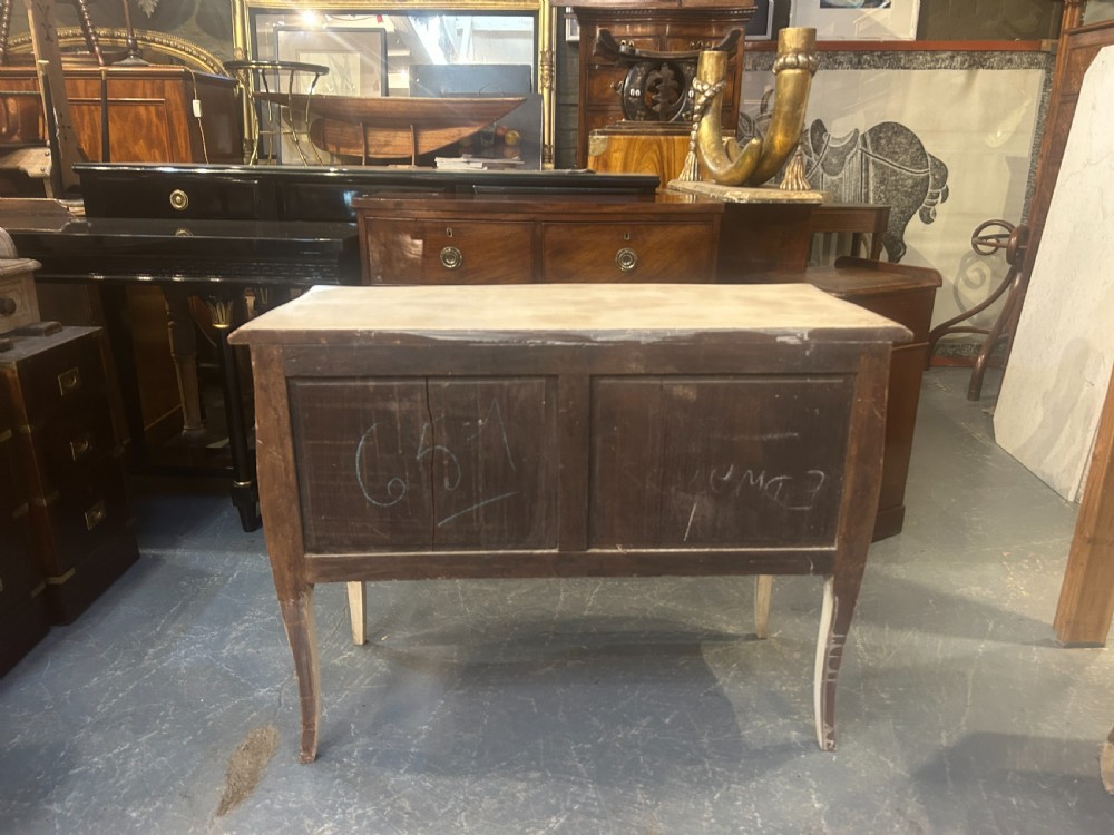 A French Louis XV style painted and gilt serpentine commode featuring two drawers, gold leaf borders, and curved cabriole legs. View IX