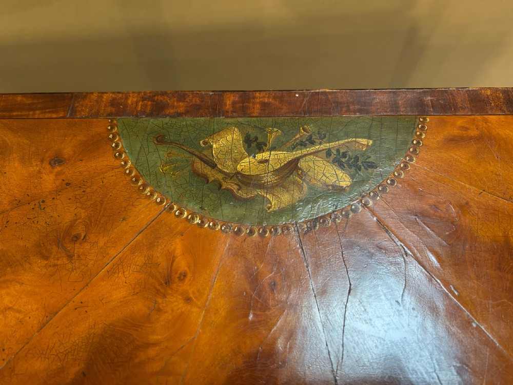 A 19th-century Sheraton style demilune card table featuring painted portrait ovals, fan marquetry, and tapered legs. View III