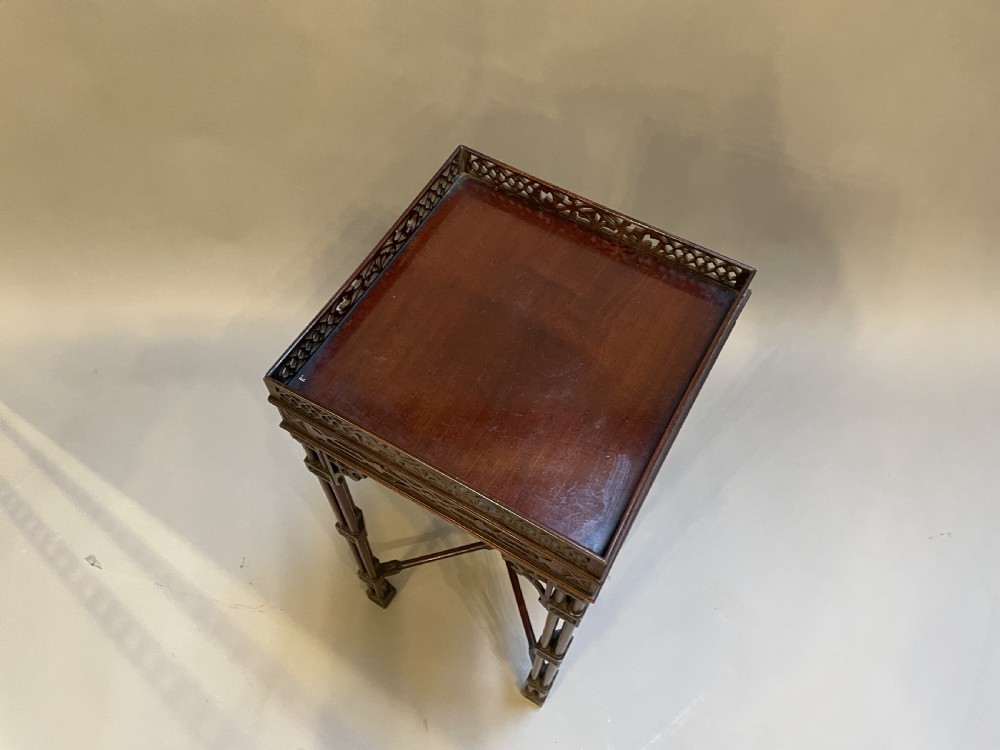 A tall mahogany Chippendale revival lamp table featuring a pierced fretwork gallery top, clustered column legs, and an X-form stretcher. View III
