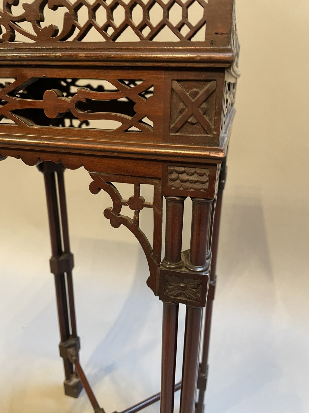 A tall mahogany Chippendale revival lamp table featuring a pierced fretwork gallery top, clustered column legs, and an X-form stretcher. View V