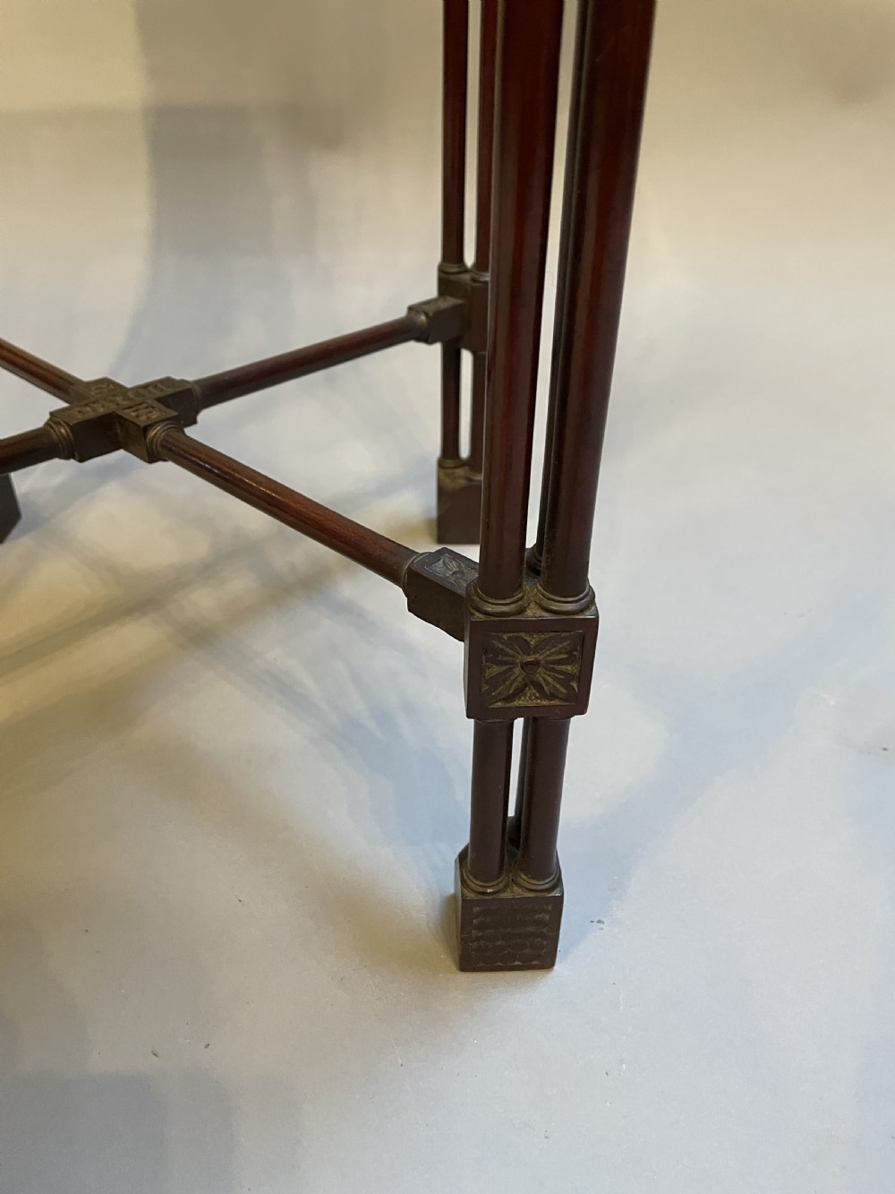 A tall mahogany Chippendale revival lamp table featuring a pierced fretwork gallery top, clustered column legs, and an X-form stretcher. View VII