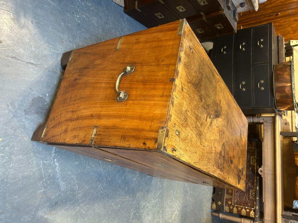 A nineteenth-century mahogany campaign chest featuring two wide drawers with flush brass handles, protective brass corner mounts, and side carrying handles. View XIII