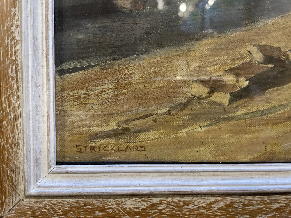 An oil painting on board depicting fishing boats drydocked in a boatyard, framed in light limed wood. View IV