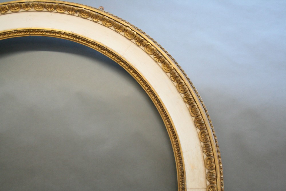 A large nineteenth-century arched pier mirror featuring a gilt and cream frame adorned with egg-and-dart moulding. View VI