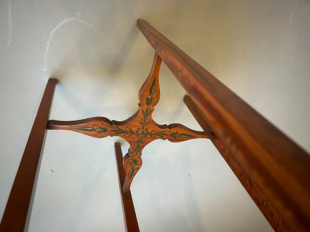 A tall octagonal Sheraton Revival side table featuring hand-painted floral garlands, a central painted vignette on the top, slender tapered legs, and a cross-stretcher. View IV