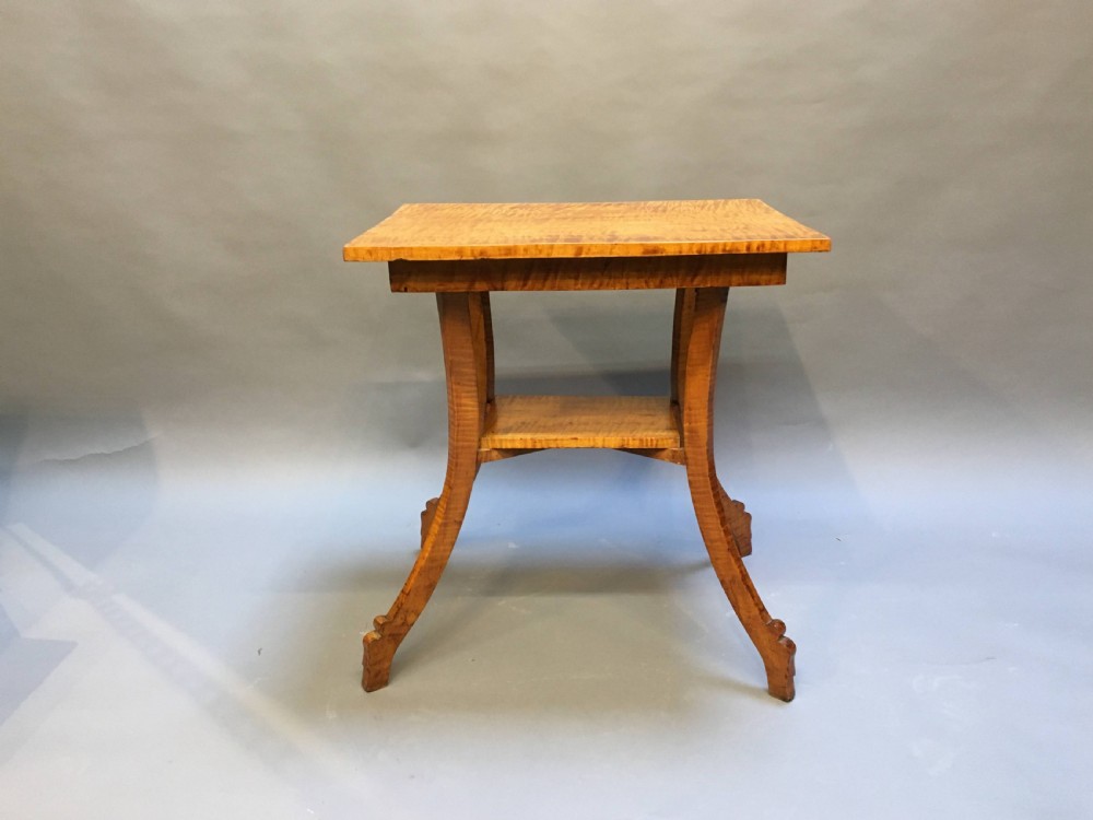 An Art Deco golden Karelian birch side table featuring a square top, lower tier shelf, and flared outward curved legs. View VII