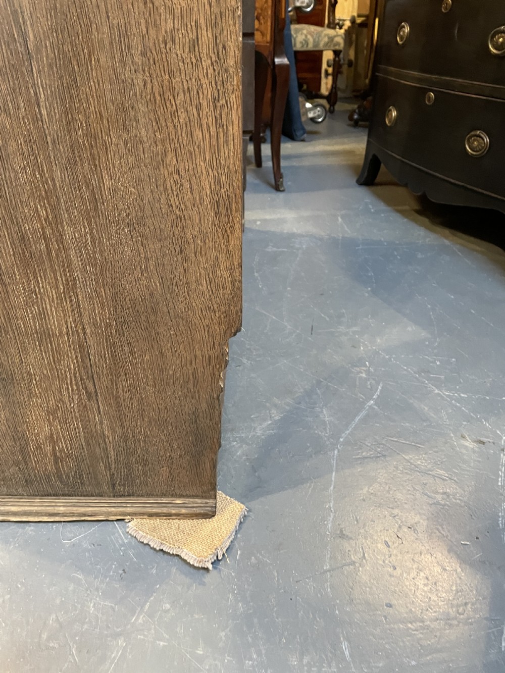 A tall Victorian light oak two-part bookcase with two upper glazed doors revealing adjustable shelves and a two-door cupboard base. View IX