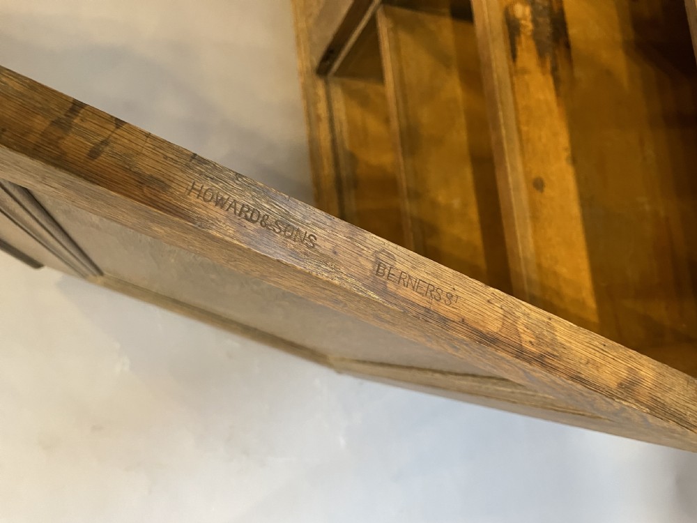 A tall Victorian light oak two-part bookcase with two upper glazed doors revealing adjustable shelves and a two-door cupboard base. View XVIII