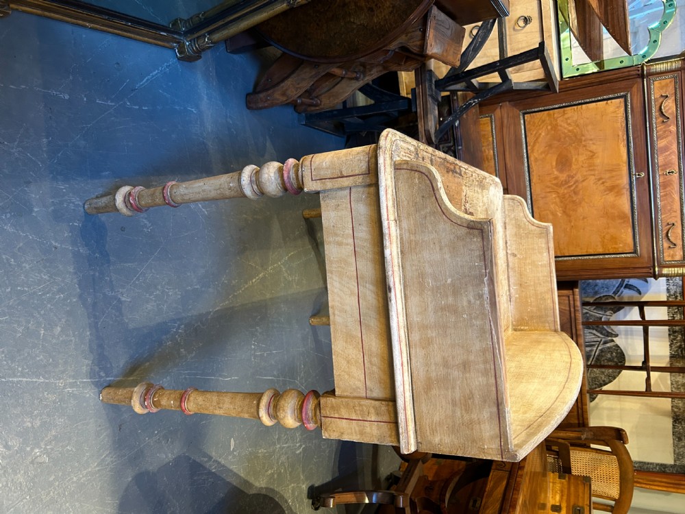 A Victorian cream painted writing table featuring a curved gallery backboard, two drawers with wooden turned knobs, and turned legs. View IX