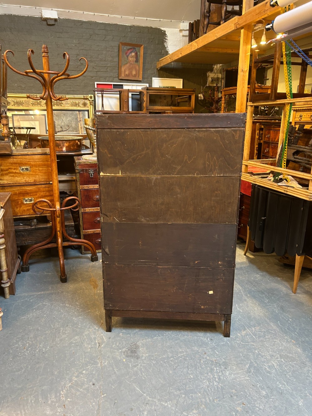 A four-tier oak Globe Wernicke stacking barrister bookcase with glazed up-and-over doors. View IX