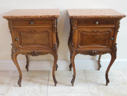 A Pair of Carved French Walnut Bedside Cabinets