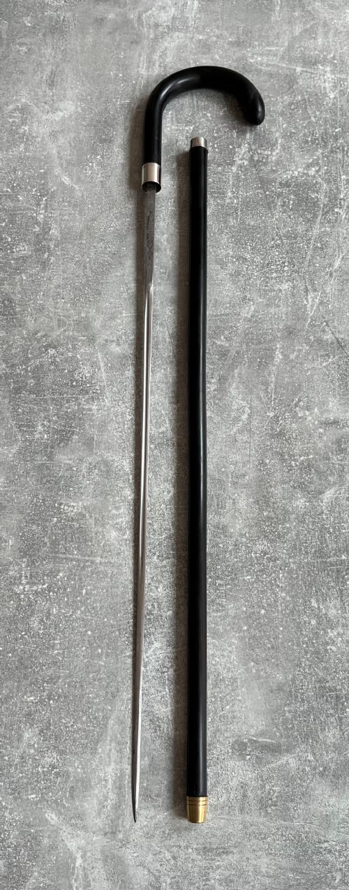 Crook Handled Malacca Sword Stick with Silver Mounts and a Toledo Blade
