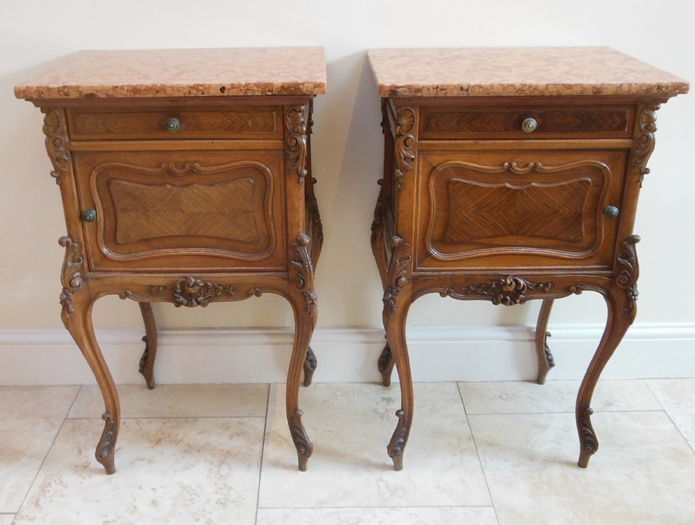 A Pair Of Carved French Walnut Bedside Cabinets