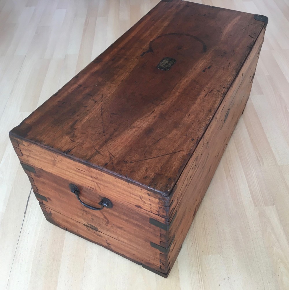 A rectangular Victorian camphor wood storage trunk with dark metal corner brackets and a brass lid plaque. View III