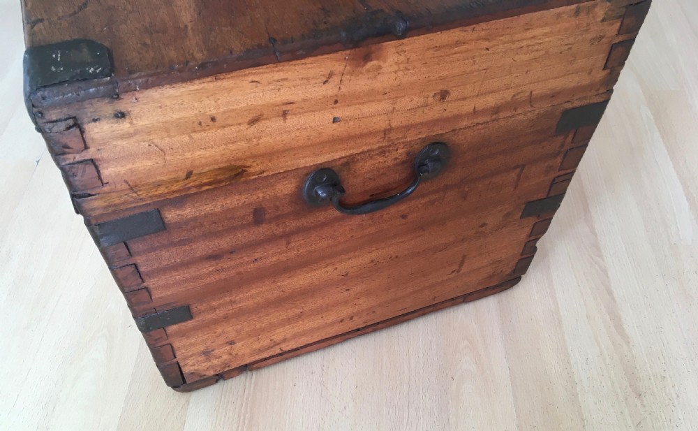A rectangular Victorian camphor wood storage trunk with dark metal corner brackets and a brass lid plaque. View VII