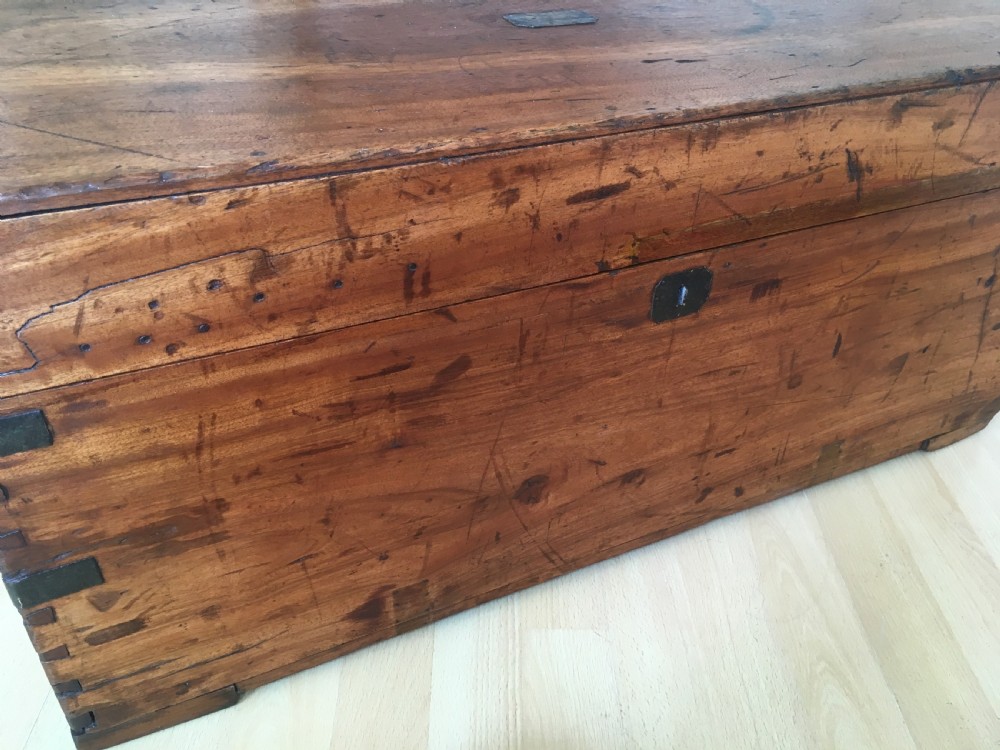 A rectangular Victorian camphor wood storage trunk with dark metal corner brackets and a brass lid plaque. View IX