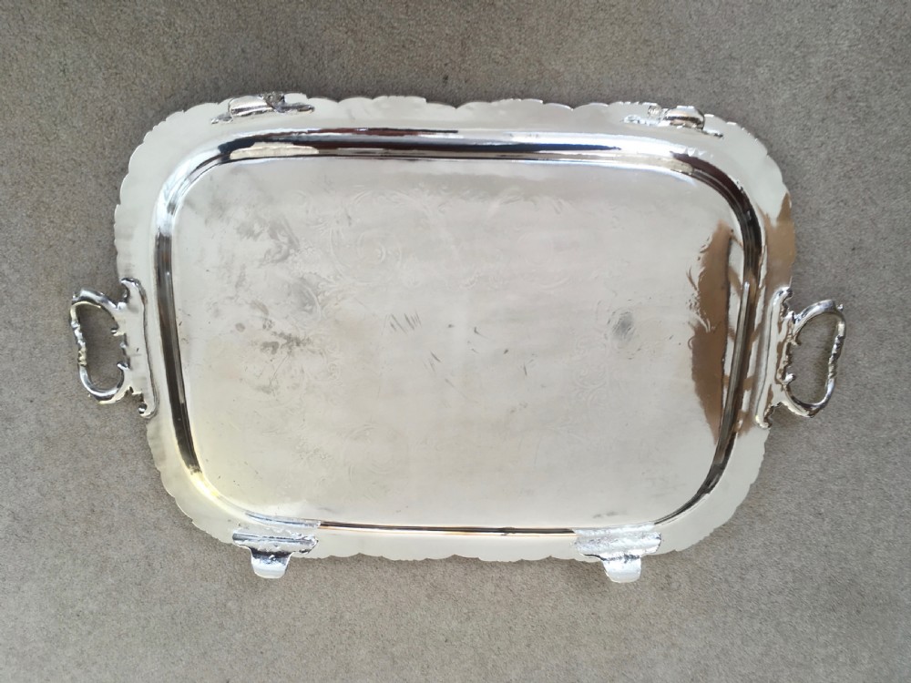 A 19th-century rectangular silver-plated serving tray featuring engraved foliate scrollwork, a decorative rim, and two cast side handles. View III