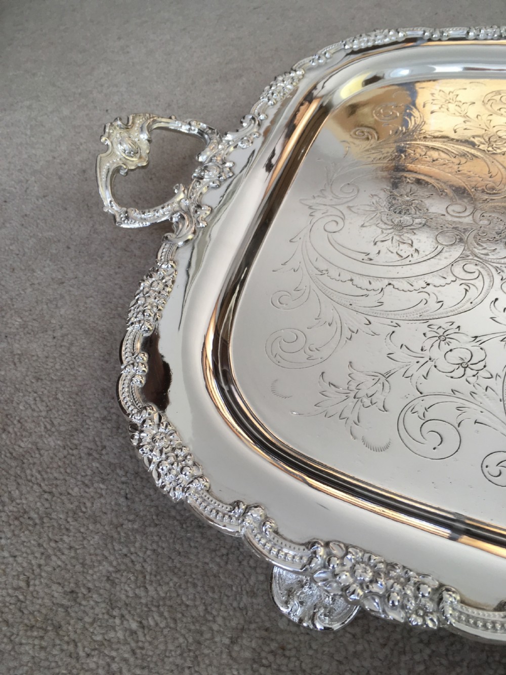 A 19th-century rectangular silver-plated serving tray featuring engraved foliate scrollwork, a decorative rim, and two cast side handles. View VII